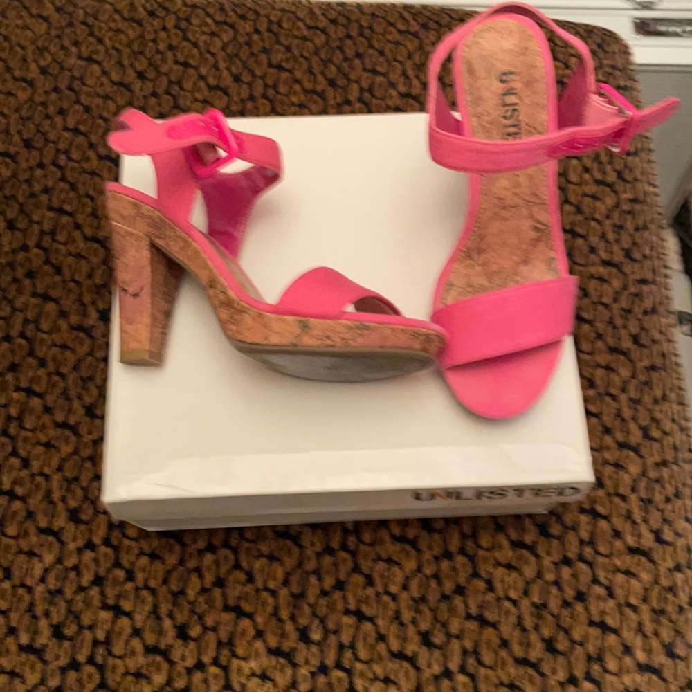 Pink heels with detailed drawings on heel